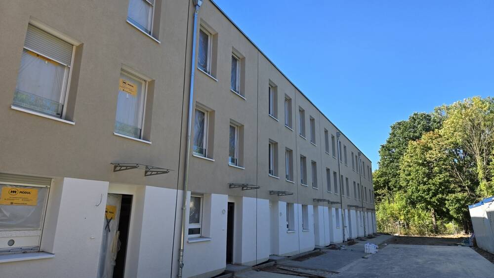 Nachhaltig wohnen, clever sparen: KfW-40-NH Haus mit umweltfreundlicher Pelletheizung 4 zimmer